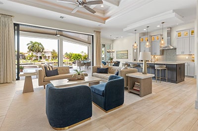View of the living room and kitchen in a modern coastal open concept home