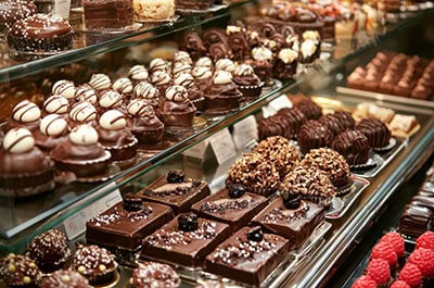 Close view of a variety of chocolates in a display case